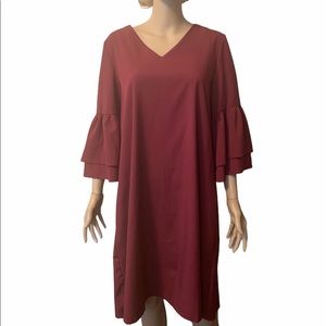 Tunic with ruffled bell sleeves, 100% polyester.